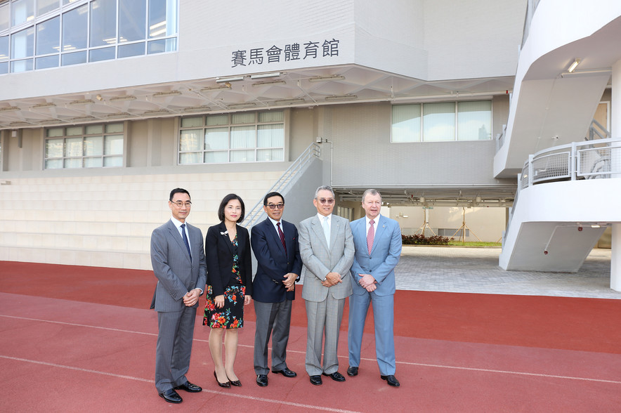 <p>To commemorate the official opening of the Jockey Club Sports Building, Mrs Betty Fung Ching Suk-yee JP, Permanent Secretary for Home Affairs (2<sup>nd</sup> left); Mr Anthony W K Chow SBS JP, Deputy Chairman of The Hong Kong Jockey Club (HKJC) (2<sup>nd</sup> right); Mr Carlson Tong Ka-shing SBS JP, Chairman of the Hong Kong Sports Institute (HKSI) (3<sup>rd</sup> left); Mr Michael Lee Tze-hau JP, Vice-Chairman of the HKSI (1<sup>st</sup> left) and Mr Winfried Engelbrecht-Bresges JP, Chief Executive Officer of The HKJC (1<sup>st</sup> right), take a photo in front of the Building.</p>
